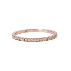 a rose gold wedding band with rows of diamonds on the inside and outside of it