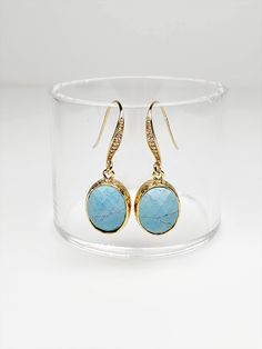 "Turquoise glass earrings, a timeless classic perfect for any occasion. Sparkling earrings feature oval faceted glass drops framed in 16k gold gracefully dangling from Gold-plated Cubic Zirconia ear wires. Dainty earrings measure 1 1/4 inches from top to bottom and the faceted glass drop is 1/2 inch wide. Silicone backs included. These dainty earrings make lovely bridal earrings, birthday gifts as well as a thoughtful sister gift, mom gift and a brilliant gift for you. Treat yourself! 🎁 Arrives Turquoise Earrings With Gemstone Accents For Formal Events, Formal Turquoise Earrings With Gemstone Accents, Elegant Turquoise Earrings With Gemstone Accents, Classic Oval Earrings With Gemstone Accents, Elegant Oval Pendant Earrings For Anniversary, Classic Oval Hypoallergenic Earrings, Elegant Oval Cabochon Earrings For Anniversary, Nickel-free Oval Earrings For Anniversary, Oval Faceted Earrings For Gift