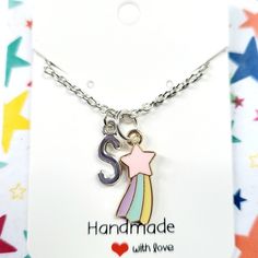 These rainbow shooting star charm necklaces and matching earrings make the perfect gift for birthday present, or a best friend, BFF, for girls.  These childrens jewellery can be personalised and you can add an initial to the necklace. Please choose the letter from the drop down menu.  These kids earrings and necklaces are made with enamel zinc alloy, zinc alloy letters and silver plated 16 inch chain.  The letters are 16x6mm small. You can message the seller if you want an 14 inch or 18 inch cha Personalized Pink Necklaces For Best Friend Gift, Playful Charms Jewelry For Birthday, Handmade Dangle Charm Necklaces For Birthdays, Playful Dangle Personalized Jewelry, Cute Charms Jewelry For Gifts, Trendy Handmade Charm Necklaces As Gift, Personalized Dangle Charm Necklaces For Birthdays, Personalized Dangle Charm Necklaces For Birthday, Cute Personalized Multicolor Charm Necklaces