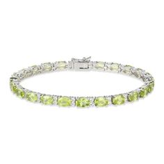 Pretty oval-cut peridots adorn this lovely bracelet styled in classic sterling silver. A duo of white lab-created sapphires twinkle between each link for extra sparkle. The 7.25-inch bracelet secures with a box clasp. Classic Green Oval Diamond Bracelet, Classic Peridot Jewelry, Classic Green Oval Tennis Bracelet, Classic Lime Green Oval Jewelry, Elegant Lime Green Faceted Jewelry, Elegant Silver Peridot Bracelets, Kay Jewelers, White Lab, Peridot Stone