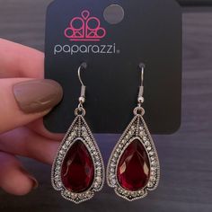 Paparazzi Superstar Stardom Red Dangle Silver Earring Trendy Red Jewelry For Festive Occasions, Trendy Red Festive Jewelry, Trendy Red Party Earrings, Red Metal Earrings For Party, Red Bling Earrings For Party, Trendy Red Jewelry With Matching Earrings, Trendy Red Jewelry Set With Matching Earrings, Glamorous Red Jewelry For Festive Occasion, Party Ruby Earrings In Silver