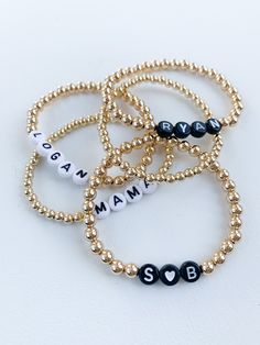 "PLEASE READ FULL DESCRIPTION BEFORE PLACING AN ORDER! This listing is for one personalized beaded name bracelet! These are perfect for stacking or even just to wear as one! They make great gifts for Valentine's Day, Mother's Day, bridal showers, baby showers and hospital gift for the new moms. ITEM DETAILS: *BEADS ARE GOLD FILLED - meaning they should last a long time with no tarnish or discoloration. *Choose from white (main color is white and letter is black) or black (main color is black and Adjustable Jewelry With Custom Text For Personalized Gift, Adjustable Custom Text Jewelry For Personalized Gifts, Adjustable Everyday Jewelry With Custom Text, Adjustable Custom Text Jewelry For Everyday Wear, Customizable Charm Bracelet For Birthday, Custom Text Beaded Bracelets With Round Beads For Friendship, Customized Adjustable Jewelry For Personalized Gift, Adjustable Beaded Name Bracelet, Custom Name Beaded Bracelets For Personalized Gift