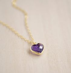 Give yourself some love or show your love for that special someone in your life with this heart necklace!Amethyst is believed to carry the energies of passion, creativity, and spirituality. It's also said to assist with temperance and sobriety, as well as inflammation.This necklace is handcrafted with a purple Amethyst faceted heart pendant. Each stone is natural and therefore contains natural inclusions or crystal formations. They are edged in 24k gold or silver electroplate. STONE SIZE: averag Heart-shaped Amethyst Yellow Gold Jewelry, Heart-shaped Yellow Gold Amethyst Jewelry, Everyday Gemstone Heart Pendant Necklace, Heart Cut Amethyst Jewelry For Gifts, Amethyst Birthstone Heart Pendant Jewelry, Dainty Heart-shaped Birthstone Necklace With Gemstone, Heart Pendant Amethyst Jewelry As Gift, Heart Shaped Amethyst Pendant Jewelry As Gift, Amethyst Heart Pendant Jewelry As Gift