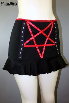 DETAILS Custom-made pentagram mini skirt created using red satin ribbon with black grommet tape on the front and a red elastic waist band. LENGTH: 13" (fits at hip) MODEL: Mannequin has 37" hip VIEW SIZE GUIDE CARE: Hand wash cold, hang dry. SHIPPING: Made When Ordered Please allow 1-2 WEEKS to ship. Gothic Stretch Mini Bottoms, Red Mini Skirt For Cosplay, Red Mini Skirt For Alternative Fashion, Stretch Halloween Mini Skirt, Emo Fitted Mini Skirt For Cosplay, Stretch Mini Skirt For Cosplay, Emo Style Fitted Mini Skirt For Party, Red Fitted Mini Skirt For Alternative Fashion, Gothic Stretch Skirt For Cosplay