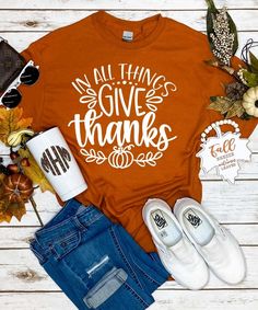 This In All Things Give Thanks Graphic Tee Shirt will be your go to shirt this fall! A must have for every Thanksgiving feast! Perfect for dressing up or down! You can wear this to any fall festivity throughout the season!

* 6 oz., 100% preshrunk cotton * Classic fit * Seamless double needle 7/8" collar * Taped neck and shoulders * Double needle sleeve and bottom hems * Quarter-turned to eliminate center crease Thanksgiving Tshirt Ideas, Fall Shirts Vinyl, Fall Tshirt Designs, In All Things Give Thanks, Thanksgiving Shirts For Women, Fall Tee Shirts, Fall Tees, Thanksgiving Outfits, Faith Clothing