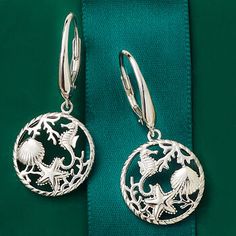 Ross-Simons - Sterling Silver Sea Life Drop Earrings. Capture the beauty of the sea with our sterling silver drop earrings, featuring a myriad of seaside creatures in an open circle design. Textured and polished finishes. Hanging length is 1 1/2". Leverback, sterling silver sea life drop earrings. Silver Ocean-inspired Earrings, Ocean-inspired Silver Jewelry With Matching Earrings, Ocean-inspired Sterling Silver Jewelry With Ear Wire, Sand Dollar Earrings, Sand Dollar Pendant, Silver Sea, Gold Sand, Sterling Silver Drop Earrings, Timeless Jewelry