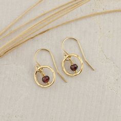 This extremely sweet pair of Small Red Garnet Circle Earrings are handcrafted for you with great care. The earring is lightweight, simple, and pretty. They are perfect for everyday wear and are a great January birthday gift! MATERIALS AND SIZE  ◆ Metal - 925 Sterling Silver, 925 Sterling Silver. ◆ Earrings measure approx. 0.75 inches / 19 mm from the top of the ear wire ◆ All earrings with French ear wires come with silicone ear backs for extra protection. ◆ Because I am using natural stones, th Garnet Drop Earrings As Gift, Gold Garnet Teardrop Earrings, Gold Teardrop Garnet Earrings, 14k Gold Filled Round Earrings For Gift, Garnet Gemstone Earrings As A Gift, Gold Garnet Earrings As Gift, Gold Garnet Dangle Earrings, Yellow Gold Garnet Earrings For Gift, Handmade Oval 14k Gold Filled Earrings