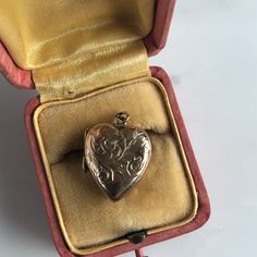 "Details: Sweet British vintage 9K rose gold heart locket with engraving. The gold has a slight rose gold tint. The photo frames are working and have original photos in them. The pendant is hanging on a 18 inch, 14K gold chain. The chain is new. Please ask all necessary questions prior to placing an order! Measurements: The locket measures 3/4\" inch by 5/8\", and is 1/4\" thick. Condition: This piece is in very good condition." Vintage Rose Gold Locket Necklace For Gift, Vintage Rose Gold Locket Necklace Gift, Victorian Gold Jewelry For Anniversary Gift, Vintage Rose Gold Locket Necklace For Wedding, Victorian Locket Jewelry For Anniversary Gift, Vintage Rose Gold Locket Necklace For Valentine's Day, Victorian Locket For Anniversary Gift, Heirloom Locket Necklace For Valentine's Day, Victorian Engraved Rose Gold Locket Necklace