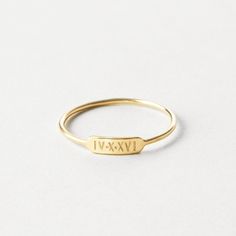 "A minimal, dainty ring that says so much! Personalize your bar ring with initials, names, dates or symbols or leave it blank. Made to last using high-quality materials and authentic hand-stamped personalization so you'll cherish it for years to come.  Every piece is handcrafted and hand-personalized with love in La Conner, WA, using 90% recycled and 100% ethically sourced raw materials from the USA--because it's better that way. Includes free gift-ready packaging (featuring a care card and traditional letterpress goodies made by my dad)!  MATERIALS: * Gold = 14k gold filled * Silver = sterling silver * Rose gold = 14k rose gold filled DETAILS: * 9x2.8mm bar * Hand-personalized with traditional metal punches AT CHECKOUT: * If you chose \"other\" for size, specify which ring size you'd like Date Engraved Ring, Ring Stamping Ideas, Minimalist Stackable Initial Ring For Anniversary, Classic Personalized 14k Gold Midi Rings, Simple 14k Gold Engraved Ring For Anniversary, Minimalist Initial Ring With Engraving Option, Minimalist Stackable Rings With Initials For Anniversary, Minimalist Engraved Ring With Engraving Option, Minimalist 14k Gold Engraved Ring With Initials