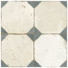 a white and blue tile floor with squares