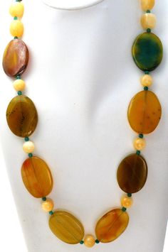 Statement Gemstone Jewelry - This is a substantial green & yellow agate and yellow quartz bead necklace. It is hallmarked 925, has sterling silver clasp and extension, chain, widest bead is 1.25" wide. It is 30" long, which includes the 2" extension, so it can be worn from 28" to 30" in length. Weight is 189 grams. Yellow Agate Jewelry With Natural Stones, Oval Jade Necklace With Natural Stones, Unique Yellow Jewelry With Gemstone Beads, Oval Agate Gemstone Bead Necklaces, Oval Agate Gemstone Beaded Necklaces, Yellow Beaded Necklaces With Natural Stones As Gift, Yellow Beaded Necklaces With Natural Stones For Gifts, Yellow Gemstone Beaded Necklaces As Gift, Yellow Gemstone Beaded Necklace For Gifts