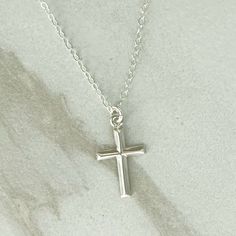 GRACE CROSS Necklace * Sterling Silver Cross Necklace * Dainty Cross Necklace* Delicate * Dainty *  Minimal * Silver Cross Necklace 14k Gold Filled GRACE Cross necklace in the last photo is sold in a separate listing:  https://www.etsy.com/listing/1737564118/grace-cross-necklace-14k-gold-filled LENGTH:  Available in:    14", 16", 18", 20" or 24"  - each comes with a 3" extender MATERIALS: Fine chain is Sterling Silver.  Clasp and connector rings are also Sterling Silver. Cross pendant is Sterling Silver and is 10x17mm.  See the photo with a ruler for size in inches.  The pendant is small and dainty. CARE:  Water and perfume are what cause most tarnishing - so the necklace needs to be stored in a dry place and not worn in the shower.  Limiting perfume in the neck area will also prolong the Necklace Simple Silver, Cross Necklace Simple, Dainty Cross Necklace, Silver Cross Necklace, Sterling Silver Cross Necklace, Sterling Silver Cross Pendant, Sterling Silver Cross, Necklace Dainty, Necklace Sterling Silver