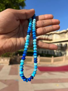 Natural Shade Blue  Round Shape Smooth Opal Beads Necklace ,7-10 mm Opal Beads, 16 Inch Strands Necklace AAA+ Quality. Gemstone  :    Opal. Color           :    Shade Blue. Size             :     7-10 mm size. Shape         :    Round Smooth Shape. Style           :    Smooth Handmade Beads.  Quality       :    AAA+ Length       :    16''  Strand.  For   :   Necklace, Jewelry Design, Craft Making, Gift, Etc.   These Are Natural Gemstones Therefore, Variation In The Shade & Quality Is Expected. Gemstone Picture Shown Are Of Actual Gemstone That You Will Receive, However, The Color & Appearance May Look Slightly Different Depending On Your Monitor Resolution & Climatic Condition. Some Imperfections Can Be Expected As Stones Are Natural. If Required, Please Ask Us To Show The Lot Image Before Blue Polished Beads For Beach, Turquoise Beaded Round Beads Gems And Cabochons, Blue Gemstone Beads For Gifts, Blue Polished Beaded Bracelets For Healing, Blue Beaded Gems And Cabochons For Gift, Blue Beaded Bracelets For Healing, Blue Round Spiritual Beads, Hand-strung Blue Beaded Bracelets With Round Beads, Hand-strung Blue Beaded Bracelets