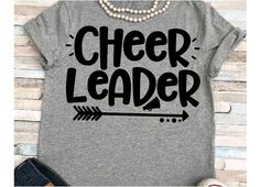 a shirt that says cheer leader with an arrow on it