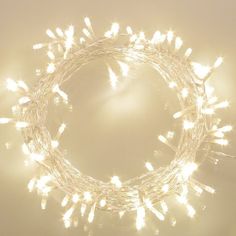 a string of white lights on a wall