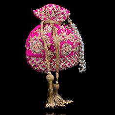 A perfect blend of Indian intricacy and Iranian design! This stunning pouch bag is dazzled with zardozi embroidery, sequins work and pearl moti with tassel finishing in the end. In-stock & ready-to-ship. *Please note, The placement of the embellishments may vary slightly as each bag is handmade and has unique qualities each time it is remade. We use faux stones and beads in all of our jewelry. Iranian Design, Zardozi Embroidery, Faux Stone, In The End, Classy Women, Pouch Bag, Festival Captain Hat, Hand Embroidered, Captain Hat