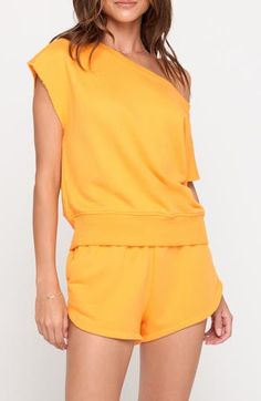 Raw edges and a boxy fit add to the laid-back appeal of this off-the-shoulder top fashioned in a vibrant solid hue. 22" length (size Medium) Off-the-shoulder neck Short sleeves 75% cotton, 25% modal Machine wash, tumble dry Made in the USA Oversized Off-shoulder Loungewear Top, Casual Solid Color One Shoulder Top, Casual One-shoulder Top In Plain Color, Casual Solid Color One-shoulder Top, Solid Casual Off-shoulder Top For Spring, Casual Oversized Boat Neck Top, Chic Yellow One-shoulder Top, Solid Color Athleisure Tops For Spring, Chic Oversized Boat Neck Top