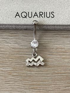 This silver belly button ring is available with any zodiac symbol charm! Great gift for birthdays! Drop jaws with this body jewelry.Details & Size:♥ 316L Surgical Steel♥ Cubic Zirconia Gems♥ 10mm bar, 14G♥ Externally Threaded Gemini Leo, Jewelry Package, Belly Piercing Jewelry, Belly Button Jewelry, Daith Earrings, Rings Unique, Eyebrow Piercing, Leo Virgo, Belly Piercing