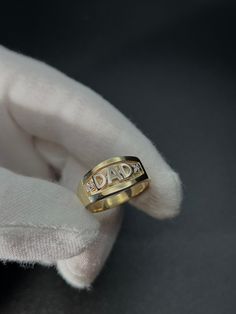 This is our Dad ring, the perfect gift for the Father figure in your life! - Made with solid 10KT gold and two cubic zirconia stones - Stamped "10KT" for authenticity - Made to order in any finger size, please allow 1-2 weeks for production Wear with love and care <3 ------------------------------------ SHIPPING POLICY - Items in stock ship typically within 1-3 business days.  - Certain items ordered in specific sizes/lengths (such as most of our rings) are made to order and require 5-10 busines Dad Ring, Father Figure, The Father, Rings Statement, Statement Rings, Fathers Day, Father's Day, Solid Gold, Cubic Zirconia