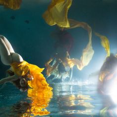 the woman is floating in the water with her head above the water's surface