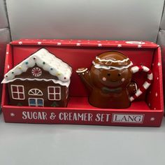 two gingerbread houses in a red box