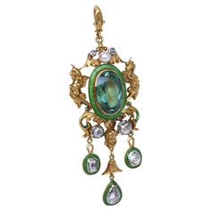 Art Nouveau Tourmaline Enamel Diamonds Yellow Gold Pendant. Created around 1890. A massive Art Nouveau Pendant with Tourmaline and matching in color bright green Enamel and three old cut Diamonds. Mounted in Yellow Gold. The attention to detail is simply outstanding! The finish is so fine and delicate you could look at it for hours. Pictures do not do make this fine pendant justice. The funny detail is just under the massive Tourmaline a jeweler left a smiling face, and did it on both sides of t Art Nouveau Revival, Egyptian Inspired Jewelry, Art Nouveau Pendant, Antique Pendant, Deco Art, Art Nouveau Jewelry, Unusual Jewelry, Yellow Gold Pendants, Vintage Jewels