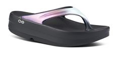 The OOmega OOlala is a versatile, modern take on the traditional OOlala active recovery sandal. Still featuring the same proprietary OOfoam™ technology and patented footbed design - the addition of the MEGA midsole gives you an extra 15mm of impact-absorbing OOfoam™ technology. The OOmega is a step forward in fashion and another step into active recovery. OOmega, a women’s platform sandal for trend-setting recovery, day or night. Unique in footwear and only from OOFOS. Luxe: Vibrant treatments a Oofos Shoes For Women Size 8, Casual Ortholite Insole Flip Flops For Surfing, Ortholite Insole Slip-on Footbed Sandals For Vacation, Comfortable Open-toe Sandals With Ortholite Insole, Ortholite Insole Lace-up Running Shoes For Jogging, Recovery Sandals, Active Recovery, Women Platform Sandals, In Fashion