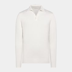 This off-white long sleeve polo is tailored to a slim fit and features a classic button collar, mother of pearl buttons, and ribbed hem and cuffs. Classic White Polo Shirt With Ribbed Collar, Luxury Formal Polo Sweater With Ribbed Collar, Classic Polo Sweater With Button Cuffs For Winter, Classic Winter Polo Sweater With Button Cuffs, White Elegant Collared Polo Sweater, Elegant White Polo Collar Sweater, Elegant White Polo Sweater, Classic Polo Sweater With Buttons For Work, White Collared Polo Sweater With Ribbed Cuffs