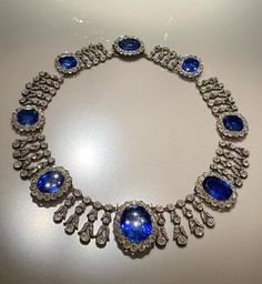 Vintage Queen Marie Amelies of France blue sapphire necklace in 915 sterling silver nd Cubic Zircon 17 inch long  Metal Purity:925 ⁵ Metal weight: 780.00 gram Stone :stimulated zircon CZ Clarity: AAAAA stone Ctw: 20.90ctw Gemstone: Blue sapphire  Gemstone creation: lab created  Item length:17.00 inch Item finished in 18k white gold plated on silver Luxury Sapphire Necklace Hallmarked, Luxury Blue Diamond Necklace For Formal Occasions, Blue Luxury Diamond Necklace For Anniversary, Blue Diamond Necklace For Formal Occasions, Luxury Blue Diamond Necklace For Anniversary, Dazzling Blue Necklace With Brilliant Cut, Luxury Blue Diamond-cut Necklace, Formal Blue Diamond Gemstone Necklace, Luxury Silver Tanzanite Necklace