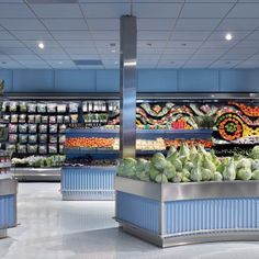 an empty grocery store filled with lots of fresh produce