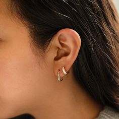 Made with ever-lasting 14K Gold, these hoops feature a sleek and stylish U-shaped silhouette that will elevate any outfit. Don't miss out on these must-have earrings! 14K Solid Gold Hypoallergenic, lead and nickel free Thickness 3mm Inside Diameter 12mm Weight: 2.05gr Hinge opening, Click to close #ES188-G Fine Jewelry Earrings, Piercing Chart, Tragus Daith, White Gold Hoop Earrings, White Gold Hoops, Types Of Piercings, Precious Opal, Metal Shop, Cartilage Earrings