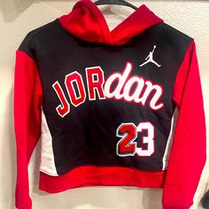 Girls Jordan Hoodie Nwt. I Have 2 Medium 10-12 Years And 1 Large 12-13 Years Red Hooded Tops With Letter Print, Red Hooded Top With Letter Print, Winter School Hoodie Top, Black Hoodie With Letter Print For School Spirit, Black Hoodie With Letter Print For School, Black Hoodie With School Spirit Letter Print, Sporty Hoodie Sweatshirt For School, Winter School Fleece Tops, Fleece Tops For School In Winter