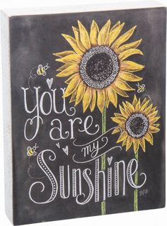 a chalkboard with the words you are my sunshine written on it and a sunflower