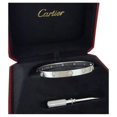 Presenting an exquisite Cartier Love Bracelet crafted from lustrous 18K white gold, adorned with 10 natural round diamonds of exceptional quality. Size 18 Elegantly designed, this bracelet weighs 32.4 grams and measures 6.1mm wide, with a size 18 fit, boasting a sophisticated inner diameter of 59x50.8mm. Each diamond, meticulously selected, contributes to a total weight of approximately 0.96 carats, showcasing a stunning F+ color grade and VS+ clarity. With a diameter of approximately 3mm, these diamonds shimmer with captivating brilliance. Stamped with the iconic "©Cartier 18 PPL*** AU750" mark, this bracelet is a testament to Cartier's renowned craftsmanship and authenticity. Accompanied by Cartier service papers, a luxurious Cartier box, and a screwdriver, this piece is not only a symbo Luxury Vvs Clarity Diamond Bracelet In Platinum, Anniversary White Gold Diamond Bracelet With Polished Finish, Cartier Round Bracelet With Single Cut Diamonds, Designer White Gold Bracelets With Brilliant Cut, Designer White Gold Bracelet With Brilliant Cut, Designer White Gold Diamond Bracelet With 17 Jewels, Designer White Gold Bracelet With Diamond Accents, Designer White Gold Diamond Bracelet With Accents, Designer White Gold Diamond Bracelet