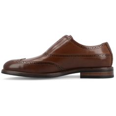 Introducing the Nikola slip-on oxford from Vance Co., a perfect blend of style and comfort with its 1-inch block heel, slip-on silhouette, and almond toe design. Crafted from faux leather with a this style offers a sophisticated and versatile option for various occasions. The faux leather lining, 6 mm Tru Comfort Foam™ footbed, and rubber outer sole ensure both style and comfort, making the Nikola a trendy and practical addition to your footwear collection. Spring Business Casual Wingtip Slip-ons, Classic Wingtip Slip-ons With Brogue Detailing, Spring Slip-on Oxford Dress Shoes, Classic Wingtip Slip-ons For Work, Classic Brown Wingtip Slip-ons, Classic Brown Loafers, Elegant Wingtip Slip-ons For Business Casual, Slip-on Wingtip Oxfords For Fall, Classic Oxford Loafers For Spring