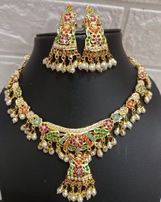 24k gold plated beautiful handmade jadau Necklace set made with craftmenship of our multi talented craftmen. Repolishable long lasting set. The product literally worth the price. Ceremonial 22k Gold Meenakari Jewelry, Festive Multicolor 22k Gold Bridal Necklace, Multicolor 22k Gold Temple Necklace For Gift, Gift Multicolor 22k Gold Temple Necklace, Gold Plated Chandbali Temple Jewelry Sets, 22k Gold Meenakari Chandbali Jewelry Sets, Heavy 22k Gold Jewelry For Navratri, Heavy Temple Jewelry Set In 22k Gold, 22k Gold Bollywood Jewelry With Latkans