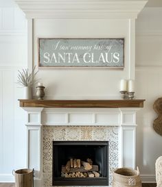 a living room with a fire place and a sign on the wall above it that says i am married most santa claus