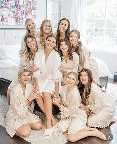 a group of women in robes posing for a photo