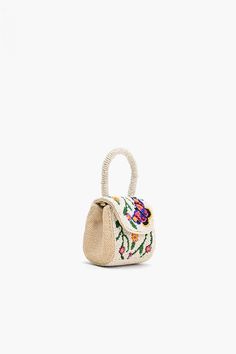 Embrace the joy of everyday adventures with our Little Flower Fun Mini Bag—an enchanting accessory designed to infuse your style with a burst of playful elegance. This mini bag is a celebration of floral charm, offering a delightful combination of whimsy and sophistication. Mini Clutch Magnetic Flap Closure Fully Beaded Front and Back Round Beaded Handle Made in Cotton Size : 3.5" x 3" x 2.5" Bead Bag, Everyday Adventures, Personalized Letters, Beaded Bags, Bold Prints, Hand Beading, Mini Bag, Accessories Design, Print Patterns