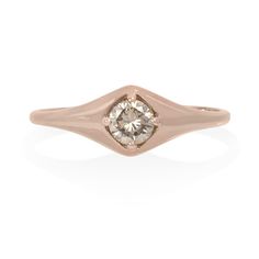 Our favorite new signet styled ring features a sparkling honey-champagne diamond set front and center. A round brilliant cut, this diamond offers all the fire of a classic white diamond but in a more subtle, warm hue. Great worn as a pinky ring or a full size ring! Approximately 0.28 carat. Set in 14K yellow, white or rose gold. Also available with a salt & pepper or white diamond upon request. Please contact us for customizations. Please contact us regarding expedited shipping times & rates in Vale Jewelry, Rolling Ring, Rosecut Diamond Ring, Tourmaline Stone, European Cut Diamonds, Domed Ring, Champagne Diamond, Diamond Set, Pinky Ring