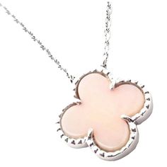 This is part of Chairish’s Fine Jewelry assortment.  18k White Gold Vintage Alhambra Pink Opal Necklace By Van Cleef & Arpels. With 1 alhambra shape pink opal stone: 15mm.  This necklace comes with Van Cleef & Arpels certificate of authenticity.  Details: Length: 16.75", 15" Alhambra: 15mm Weight: 5.8 grams Stamped Hallmarks: VCA 750 BL44XXX(serial number omitted) YOUR PRICE: $5,800 T3477hedd Elegant Pink Jewelry With Polished Finish, Luxury Hallmarked Opal Jewelry, Elegant Pink Opal Jewelry Gift, Elegant Pink Opal Jewelry For Gift, Elegant Rose Gold Pink Opal Jewelry, Luxury Opal Pendant Necklace, Elegant Pink Opal Round Necklace, Elegant White Pink Opal Jewelry, Elegant Round Pink Opal Jewelry