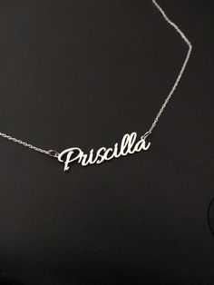 "Silver Name Necklace For Women, Personalized Jewelry, Custom Name Necklace, Christmas Gift,Personalized Gift For Women, Christmas Jewelry This personalized name necklace is a perfect gift for birthday, anniversary, christmas, bridesmaid, graduation, wedding, engagement, best friend, mom and sisters. The length of the necklace on the model is 17 \". DIMENSION * Upper Case: 8mm * Lower Case : 4mm LENGTHS * Between 13\" and 24\" * The open necklace laid straight & measured end to end. MATERIAL Elegant Name Necklace For Christmas, Personalized Black Name Jewelry, Personalized Black Jewelry With Name, Classic Custom Name Jewelry For Birthday Gift, Classic Custom Name Jewelry For Birthday, Black Nameplate Jewelry For Gift, Custom Name Black Necklace For Gift, Customized Silver Necklace For Personalized Gift, Customized Silver Nameplate Necklace