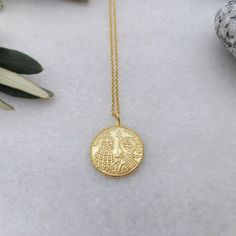 A nice 14k gold-filled necklace with an eye-catching Christian Pendant. A dainty everyday charm that brings good luck and protects the person that is wearing it. A nice gift for her Length approx. 16 inches / 40.5 ♥ All items will be delivered in a nice gift envelope to minimize shipping expenses for you! You may choose gift wrapping at checkout if you wish! If you need it sooner, select expedited shipping at checkout and leave us a note with the wishing date! ★ Read our policies before purchase Symbolic Good Luck Coin Pendant Necklace, Symbolic Gold-plated Coin Necklace, 14k Gold Medallion Necklace Amulet Style As A Gift, 14k Gold Amulet Medallion Necklace As A Gift, Brass Coin Necklace With Adjustable Chain As Gift, Good Luck Medallion Necklace With Coin Pendant, Gold Plated Tarnish Resistant Necklace For Good Luck, Tarnish Resistant Gold Plated Necklace For Good Luck, Spiritual Gold Plated Coin Pendant Charm Necklace