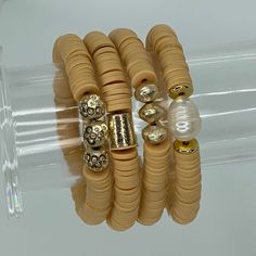 Heishi stretch bracelets are fun and lightweight. Wear them in stacks and have fun mixing and matching the colors. This hand beaded bracelet is made with high quality 8mm Heishi beads and gold accents. Available in 4 different styles:- Gold Bar- Gold Saucers- Fancy Round- Pearl Bracelets are “one size fits most” and are designed to fit wrists up to 7.0”. *Bracelets usually ship within 3-5 business days. Heishi Bracelets, Marbled Clay, Pearl Bracelets, Chic Bracelet, Stackable Bracelets, Heishi Beads, Gold Bar, Hand Beading, Bracelet Designs