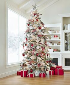 a decorated christmas tree with red and white presents