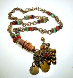 "Lariat Chain Necklace, Tribal India 1960s Coppery Brass w Gemstone Nuggets & Coins, Darkened and Moody From Age Something Old Jewelry, a Primitive Tribal Personal Piece Do not wear on a white shirt The Long coin chain Tassel Necklace is 28\" to the top of the tassel ( 71.12cm ) the Tassel is 4\" long by 2\" wide ( 10.16cm x 5.08cm ) all tarnished from age, ---------------------------------------------------------------------------- PLEASE NOTE I ONLY ship to your paid ETSY invoice address, Vintage Multicolor Multi-stone Jewelry, Vintage Necklace With Vintage Charm For Festivals, Vintage Necklaces With Vintage Charm For Festival, Bohemian Multicolor Brass Necklaces, Vintage Festival Necklace With Vintage Charm, Bohemian Multicolor Brass Necklace, Vintage Brass Beaded Necklaces For Festivals, Vintage Adjustable Multicolor Necklaces, Vintage Metal Dangle Beaded Necklaces