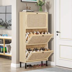 a shoe rack with baskets on it in a living room