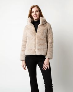 The name of cult Italian outerwear label Herno is pronounced 'air-no,' which feels appropriate — each of their pieces is featherlight and wildly soft. This is one of their signature shapes rendered in super-soft faux fur instead of nylon: a classic puffer with a high, stand-up collar and a two-way zip front. Luxury Long Sleeve Outerwear With Feather Trim, Luxury Feather Trim Outerwear For Fall, Luxury Feather Trim Fall Outerwear, Spring Faux Fur Outerwear In Mink Color, Chic Fitted Fluffy Outerwear, Luxury Fitted Outerwear In Taupe Color, Luxury Fluffy Fur Coat For Fall, Chic Fur Coat With Faux Fur Lining, Luxury Fluffy Long Sleeve Outerwear