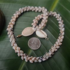 This necklace is an exquisite Kauai Momi Shell lei, that has taken many years to perfect. Not only will this necklace maintain it's integrity and luster, it will continue to gain in value exponentially. The Momi shells are only found on a few select beaches on Kauai and on the forbidden Island of Niihau. I collect my shells on the north shores of Kauai and sort each one by size, color, and quality. I then hand drill the holes in them in precisely the right place for this intricate and difficult Handmade Mother Of Pearl Jewelry For Anniversary, Luxury Multi-strand Necklace For Gift, Luxury Handmade Double Strand Necklace, Luxury Handmade Multi-strand Jewelry, Handmade Mother Of Pearl Necklace For Anniversary, Gold Double Strand Hand-strung Necklace, Artisan Wedding Necklaces With Unique Variations, Traditional Double Strand Necklace As A Gift, Spiritual Round Mother Of Pearl Necklace