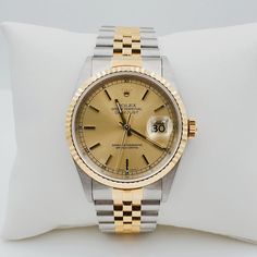 Men's Rolex 36mm DateJust 18K Gold / Stainless Steel Two Tone Watch with Fluted Bezel and Champaign Dial. UNWORN SN# U98**** Year: 1998. Brand: Rolex. Gender: Men's. Model: DateJust. Case Back: Solid. Crystal: Sapphire. Condition: Unworn. Dial Color: Champaign. Case Dimensions: 36mm. Bezel Color: 18K Yellow Gold. Movement: Self-Winding (Automatic). Metal Type: 18K Gold / Stainless Steel. Bracelet / Strap: 18K Yellow Gold / Stainless Steel. Box / Certificate: Includes Rolex Box / Rolex Paper. Ser Corum Watches, Men's Rolex, Zenith Watches, Hublot Watches, Rolex Yacht Master, Rolex Watches For Men, Panerai Watches, Breitling Watches, Tag Heuer Watch